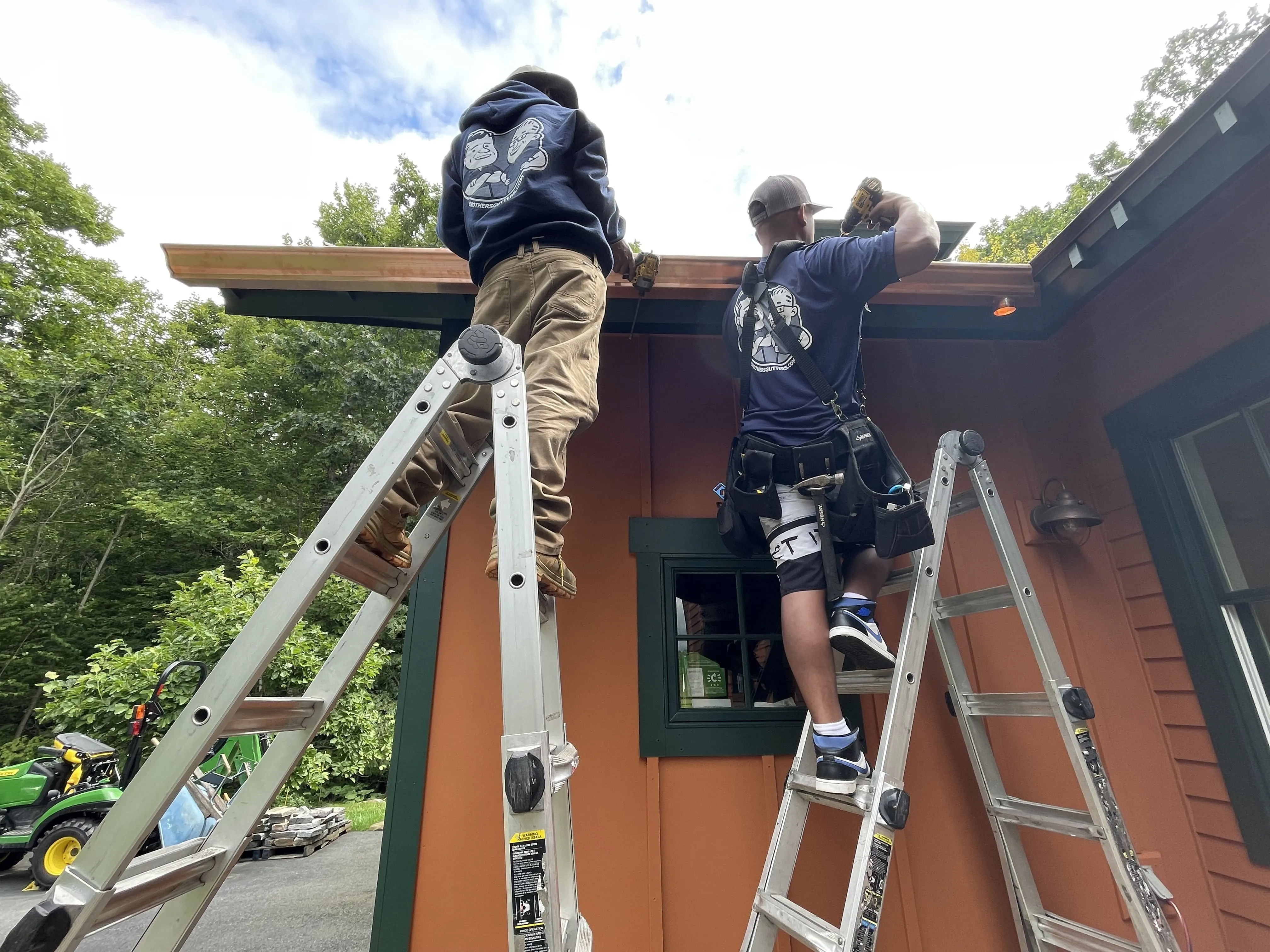 Seamless gutter installation in progress on a Capital District home, custom rain gutters fabricated on site by professional gutter installers